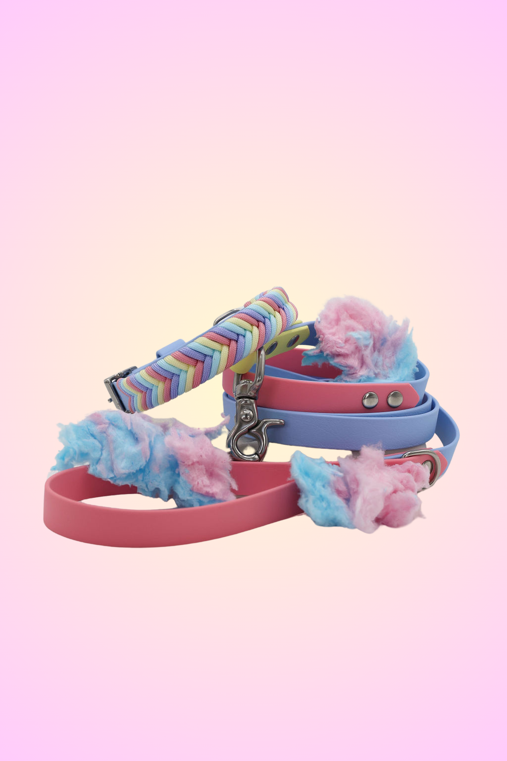 A set of colorful dog collars and a matching leash with pastel parrot colors, displayed against a neutral background.