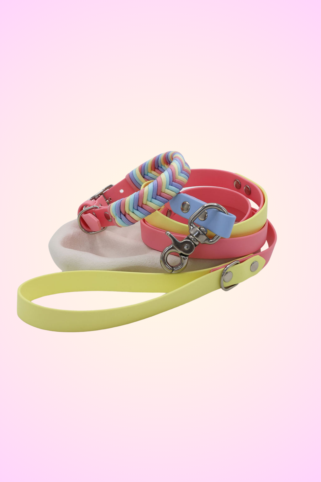 A multicolored striped dog collar with a stainless steel buckle and matching lead