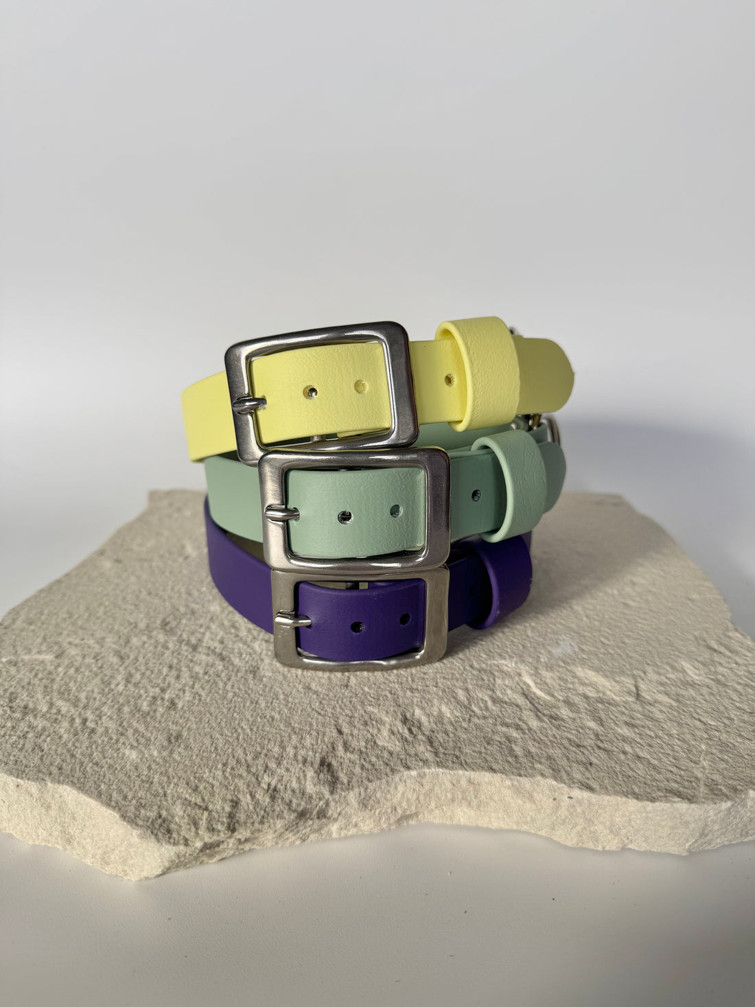 Three biothane collars stacked on top of each other